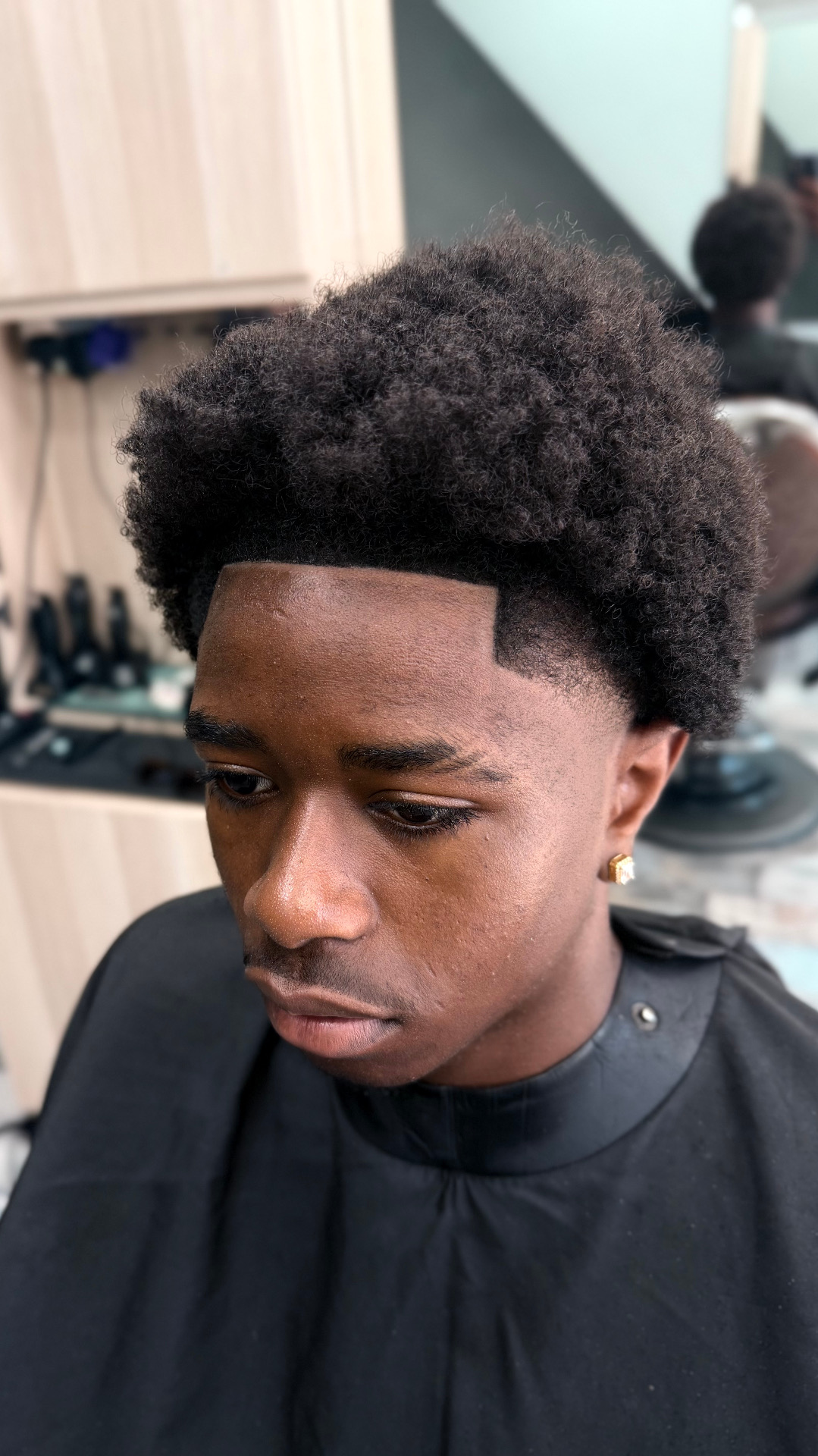 Side view of afro shape-up and defined hairline by Fresh Cutz Barbers, Harrow